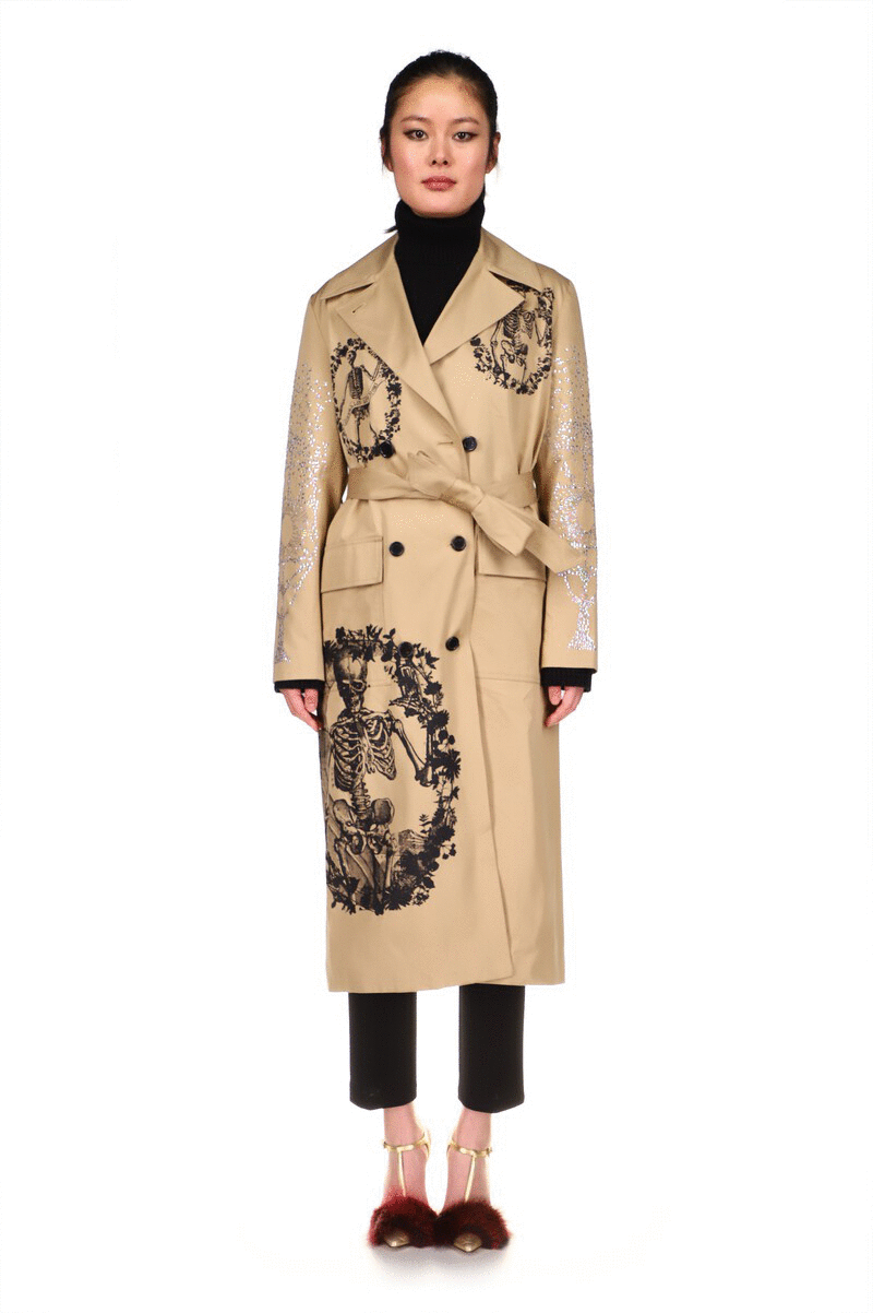 SILK SCREENED 'TOMBES' LONG LEAN TRENCH IN KHAKI WITH CRYSTAL SLEEVES - COATS - Libertine|https://cdn.shopify.com/videos/c/o/v/771fc7b5925d4f4a9c3d907ce32790ce.mp4